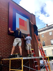 Log Cabin Quilt Block being installed in Downtown Elkins WV