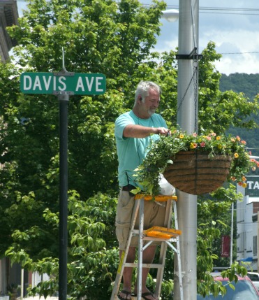 Doug Starcher working on downtown flowers spring of 2017