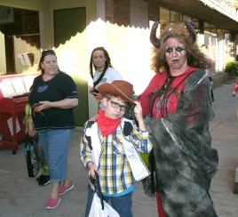 Christopher and Jolynn Powers walk the streets of Elkins at the Downtown Trick or Treat 2017