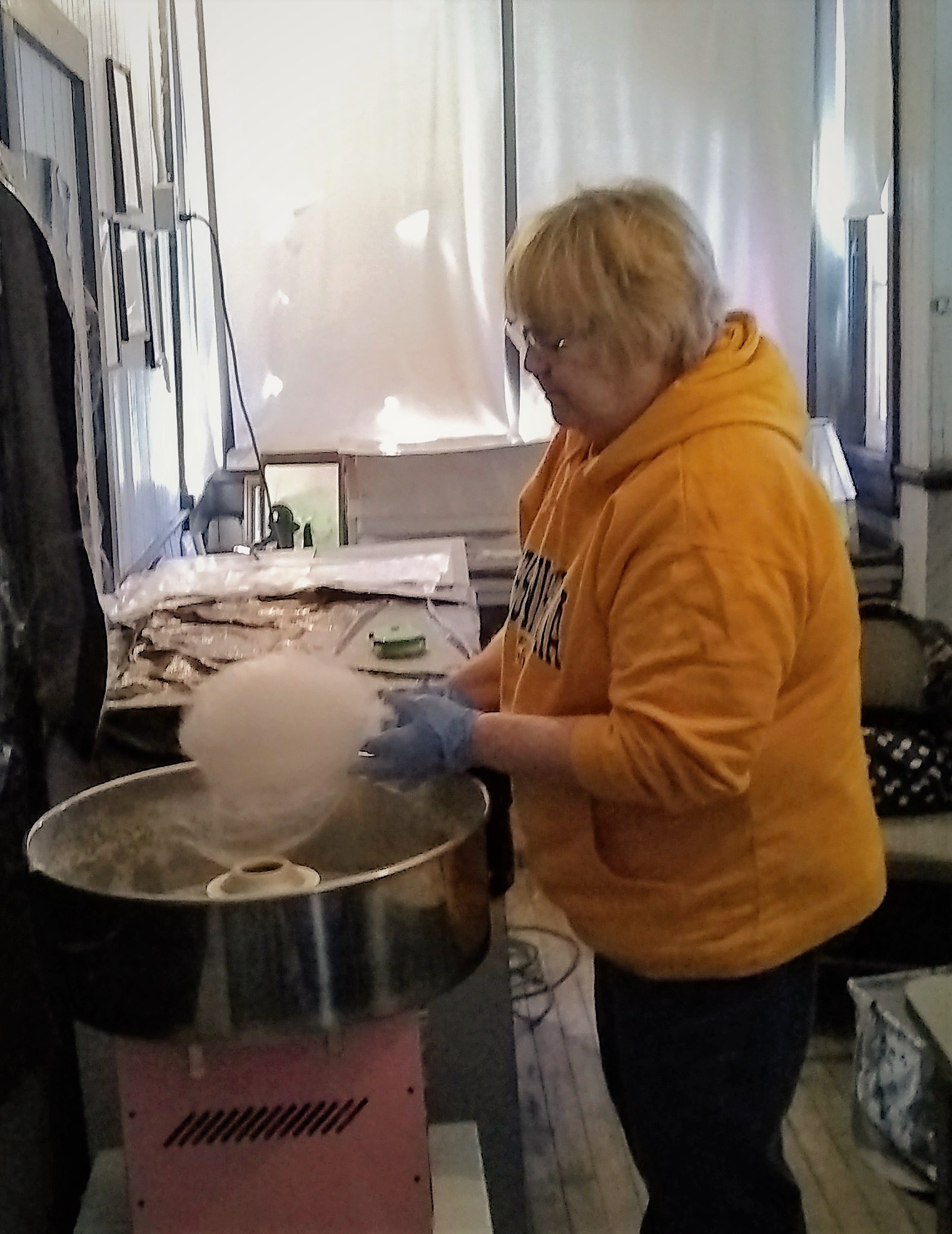 lady making Maple cotton candy maple syrup festival